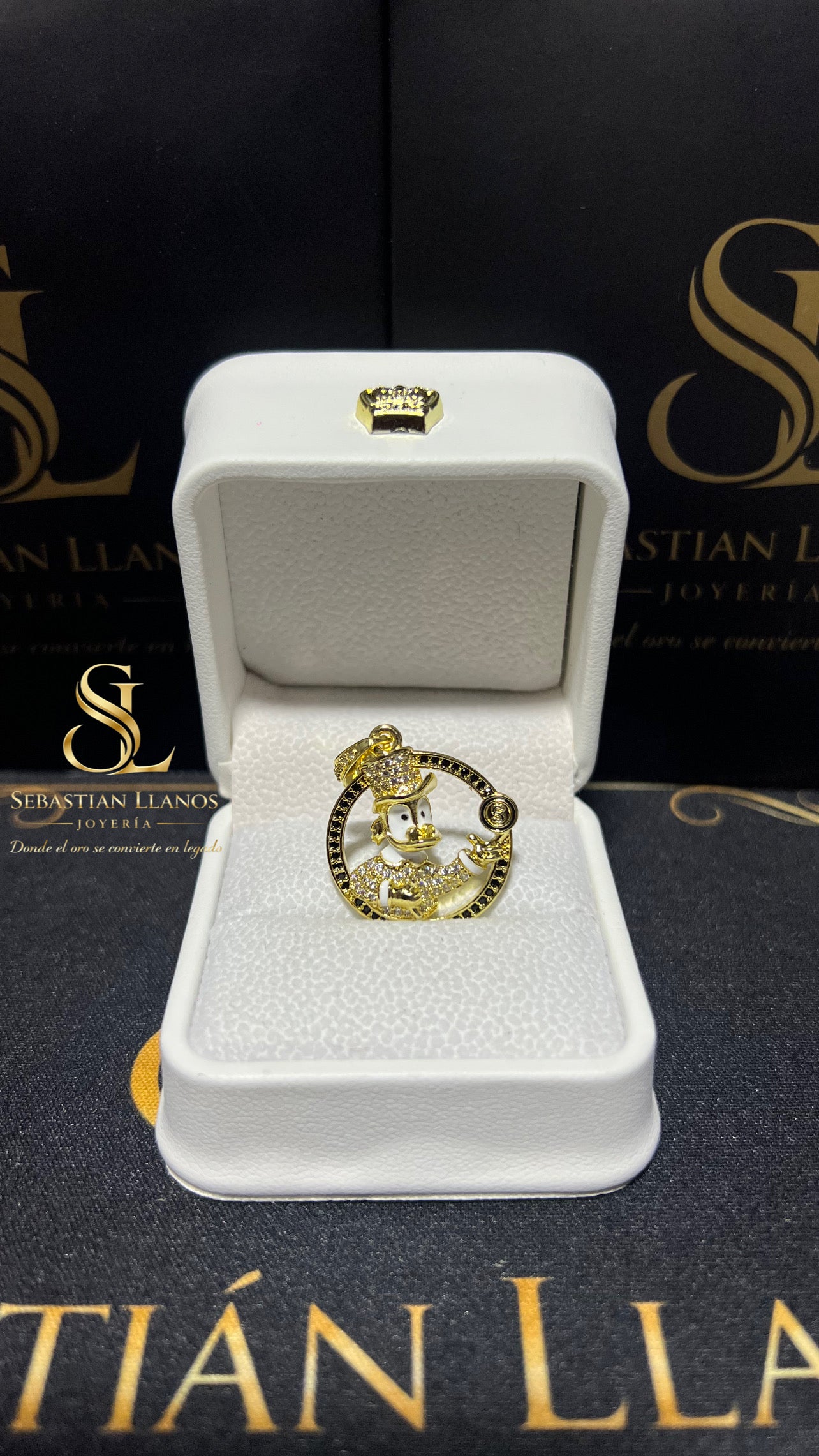 Dije tío rico moneda negro